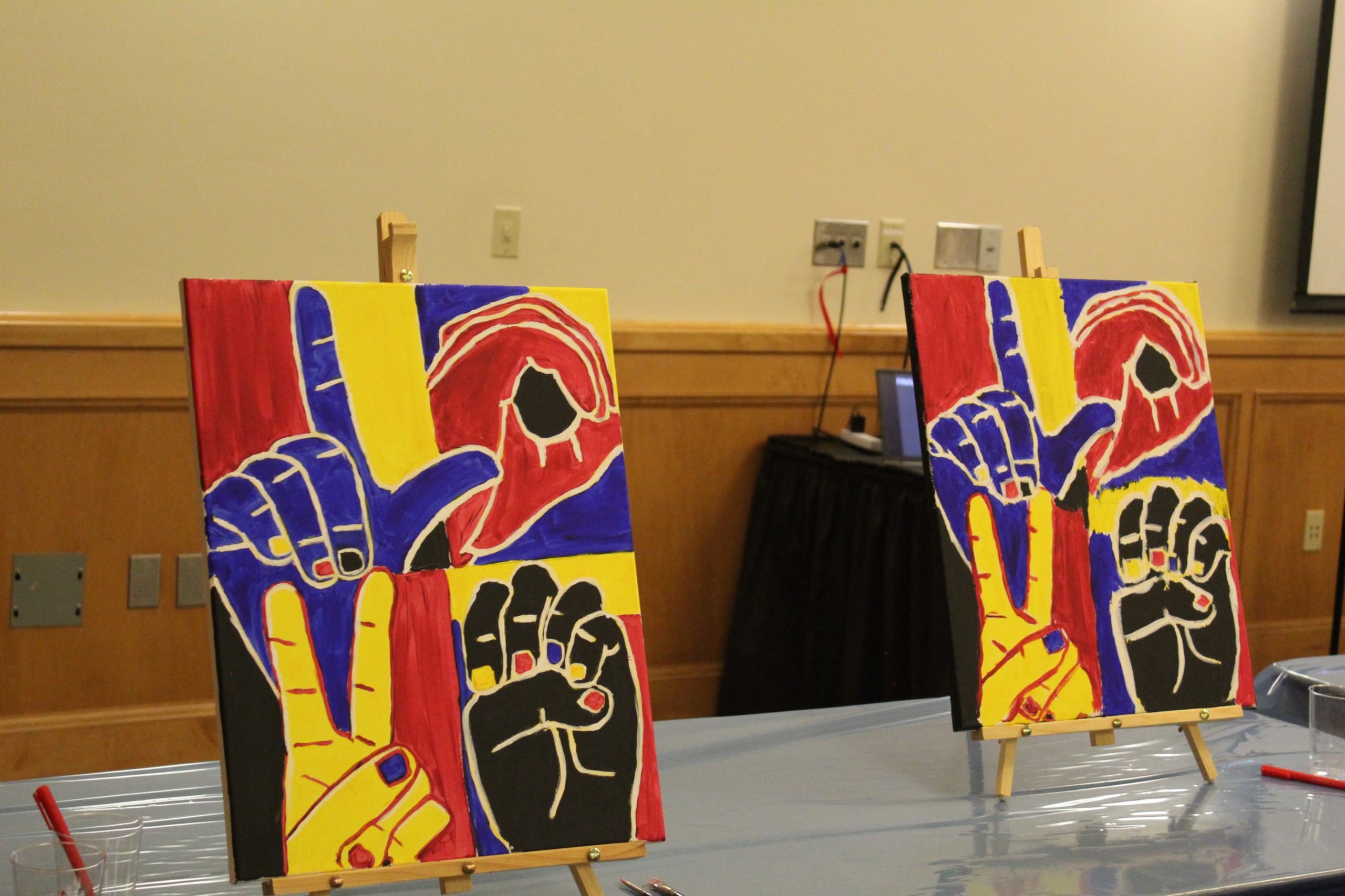 Two finished canvases in the Union Family Room made by participants of the Nancy Rourke painting workshop on Thursday, April 11, 2024. (Skylar Lewis Photo)