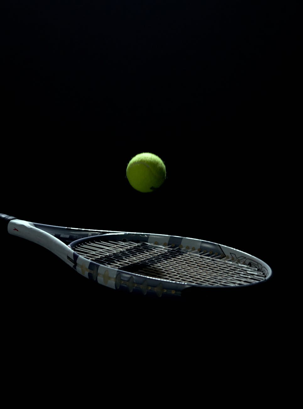 a tennis ball bouncing off a tennis racket